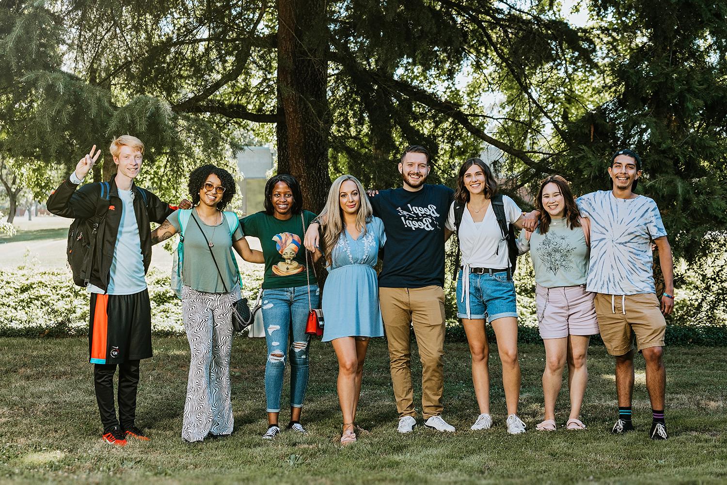 photo of students standing and smiling